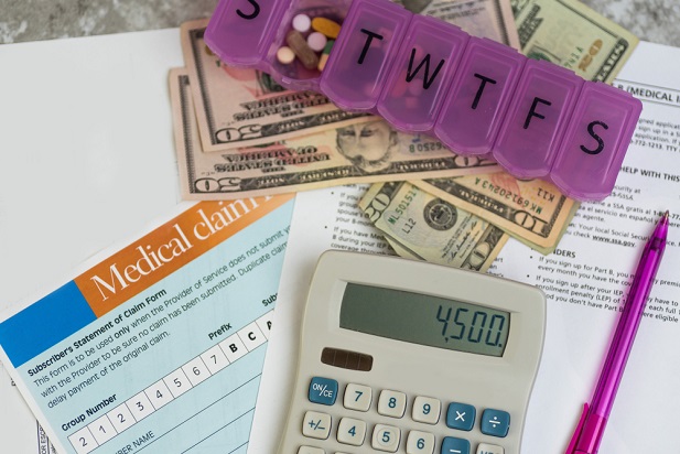 calculator and pill box on Medicare bill