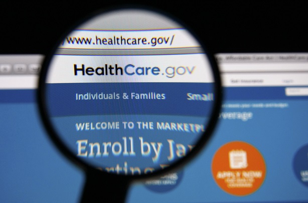 HealthCare.gov homepage with magnifying glass over part of it