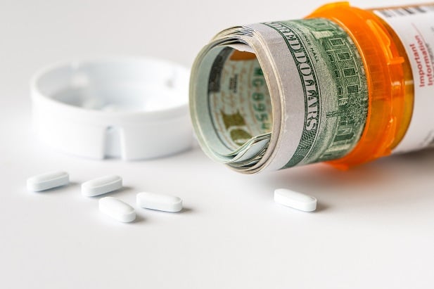 pills spilled out over U.S. currency