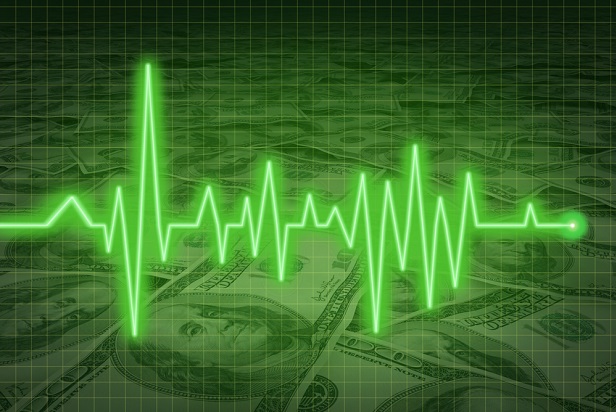 neon green ekg waves over stacks of currency