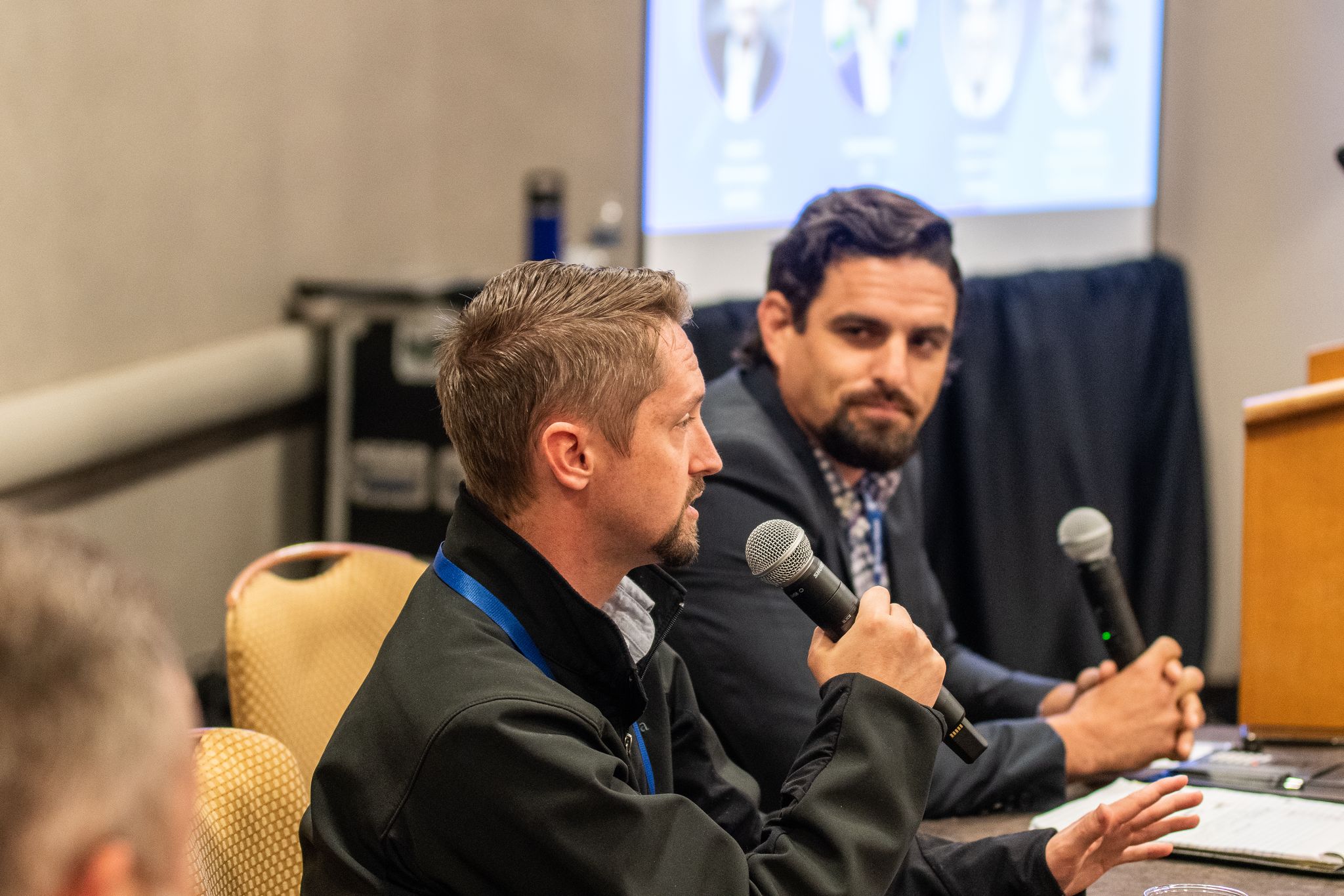 Nathan Houghton of PeakMed Direct Primary Care speaks during the track session titled "Direct Primary Care and Reference-Based Pricing: A Match Made in Heaven," as moderator Omar Arif of ClaimDOC looks on.