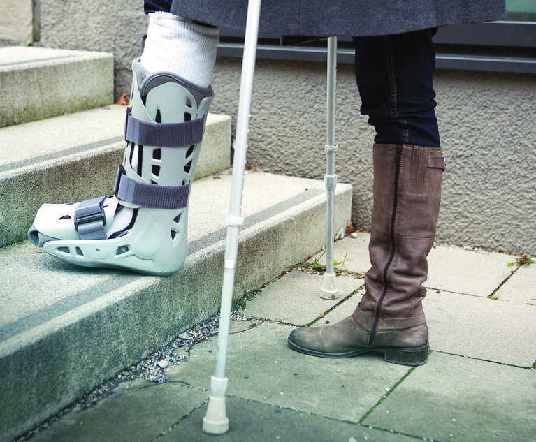 closeup of woman walking with crutches