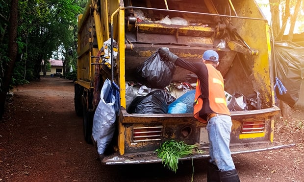 Garbage-truck-worker-620x372