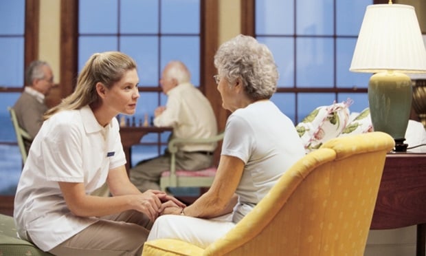 Nurse with woman in nursing home