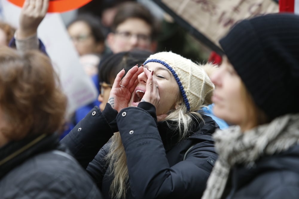 A millennial protesting after President Trump's election