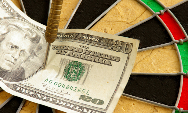 $20 bill on dartboard