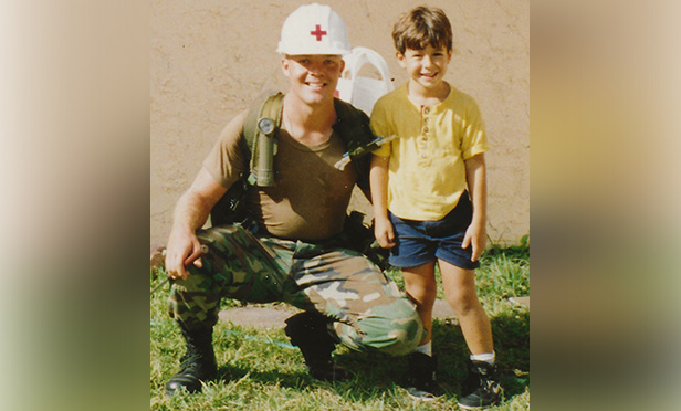 Neal Nolan in Army uniform with young boy