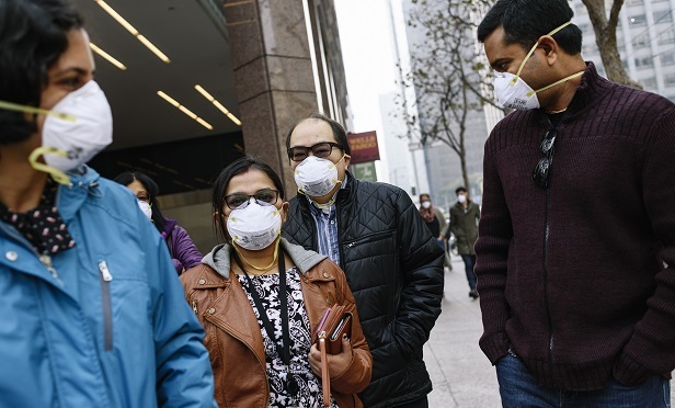 Workers wearing masks